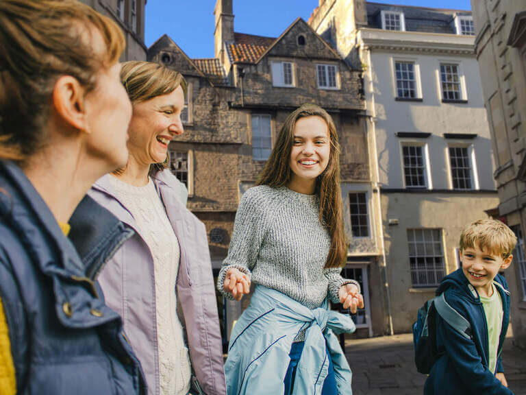 A family walking through the streets of Bath