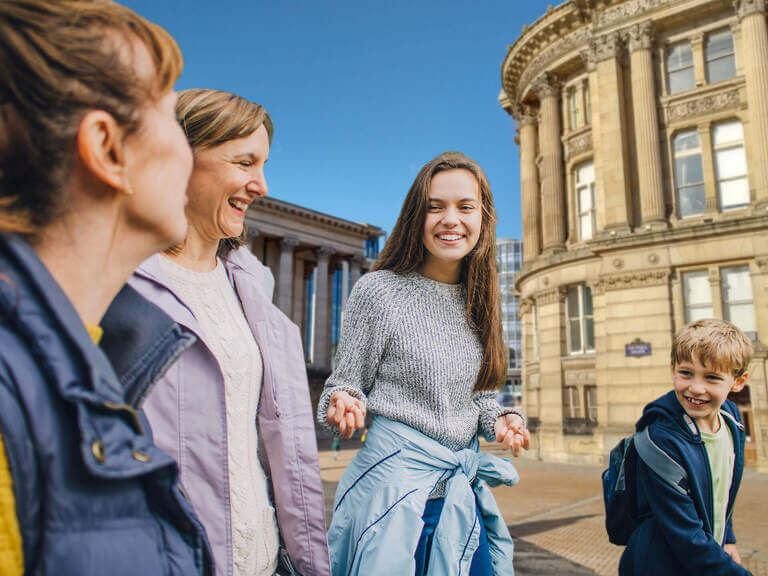 A family walking through the streets of Birmingham