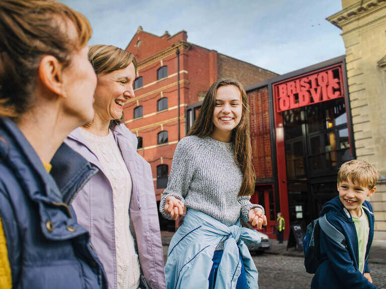 A family walking through the streets of Bristol