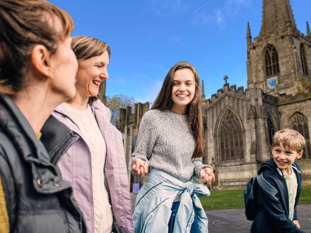 A family walking through the streets of Sheffield