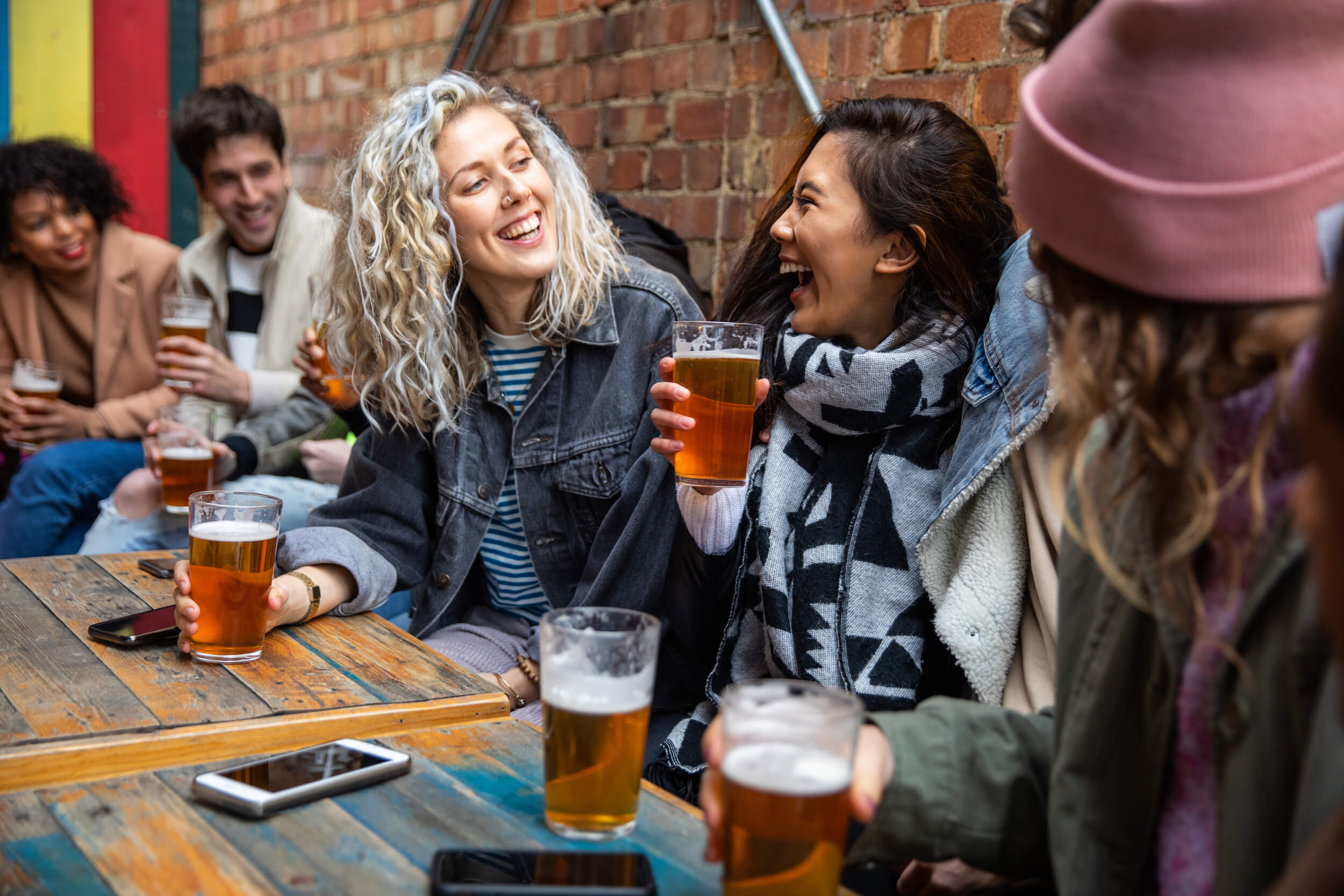 A group of hens together in the pub, taking a break from playing a treasure hunt
